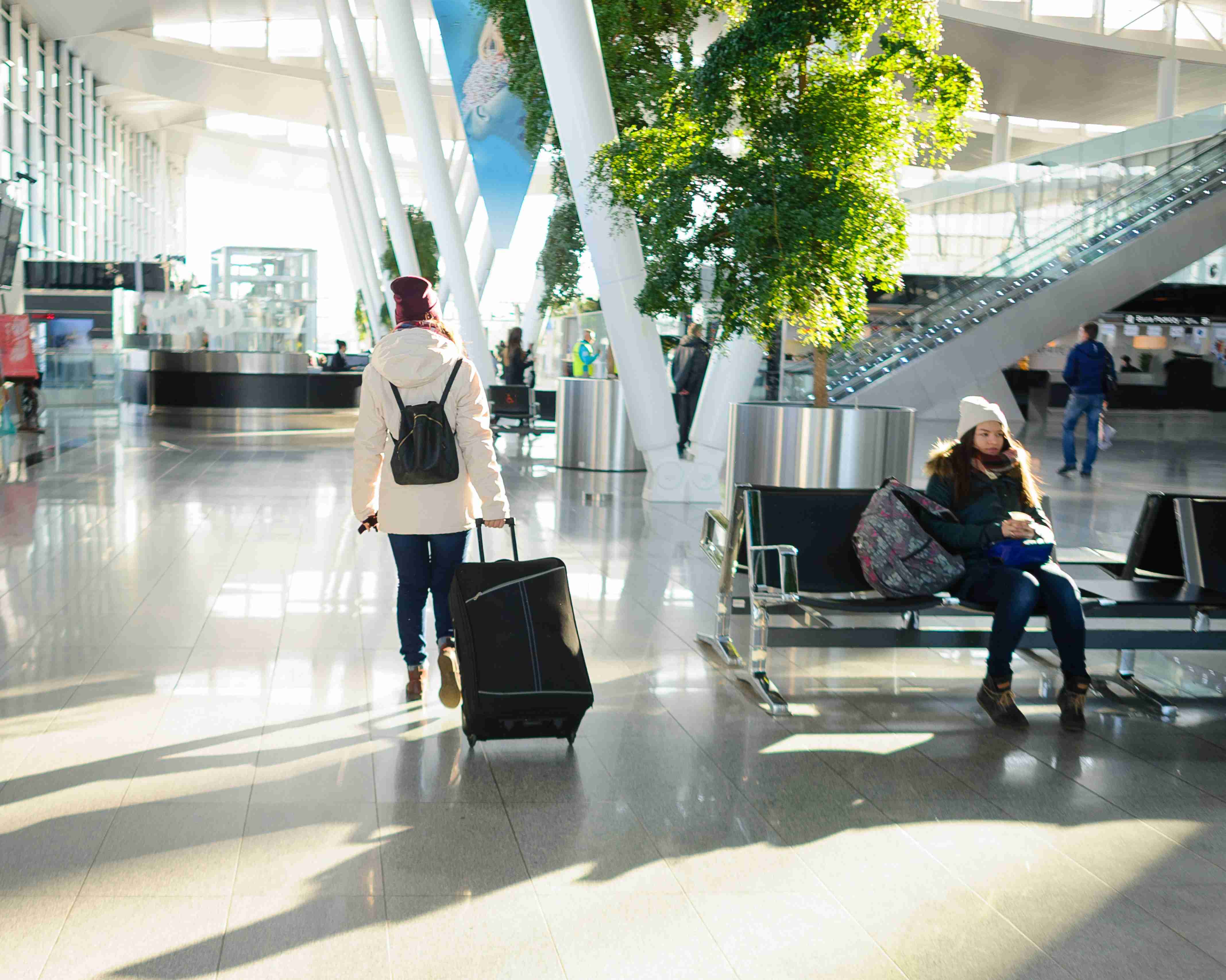 Passengers waiting inside the airport terminal